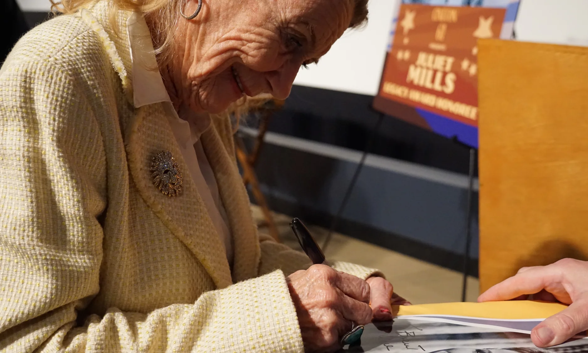 Juliet signing autographs